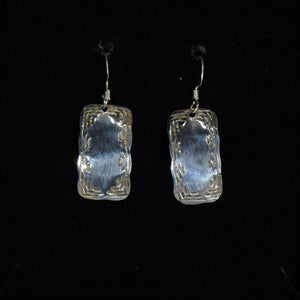 Silver earrings.