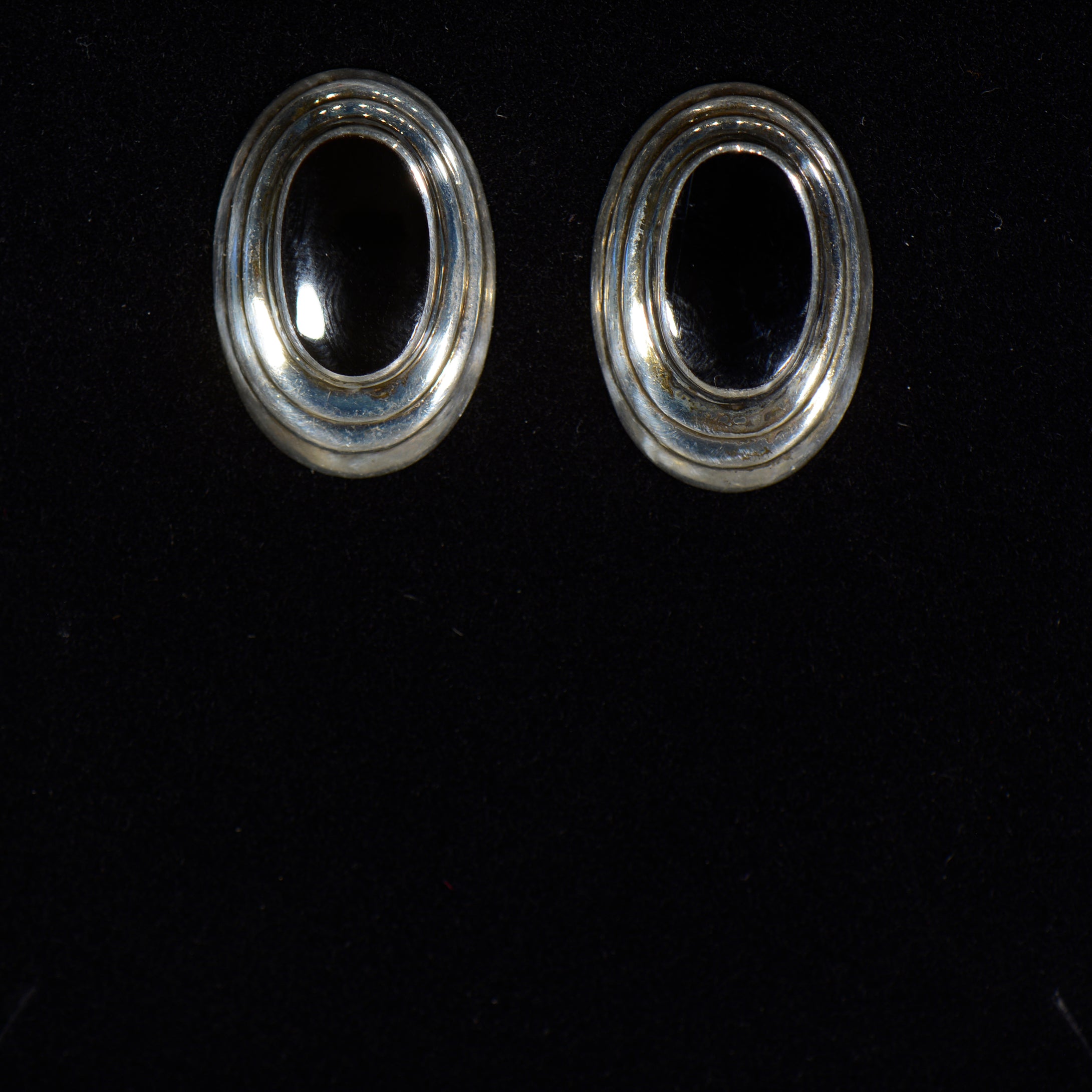 Silver and onyx earrings.