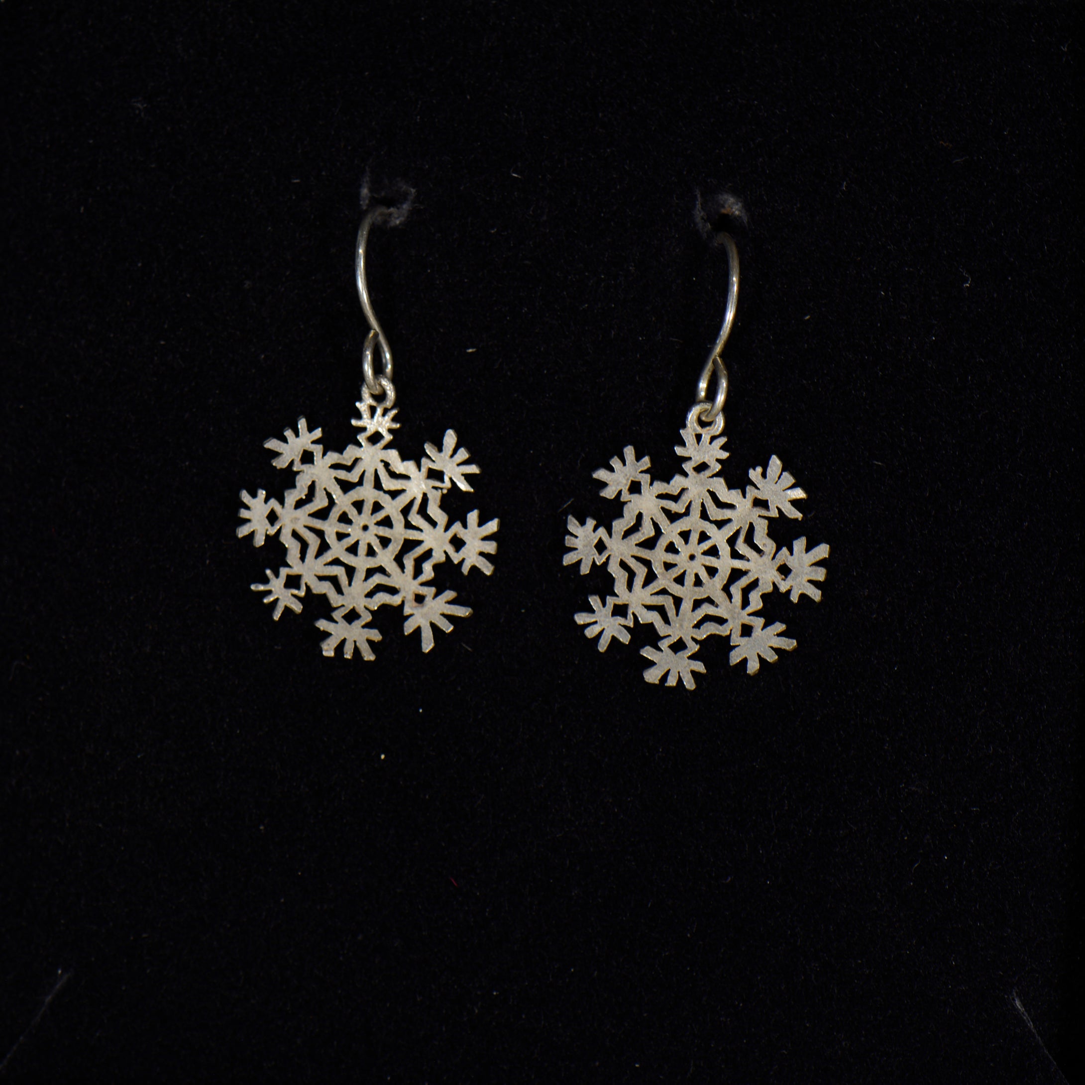 Silver snowflake earrings.