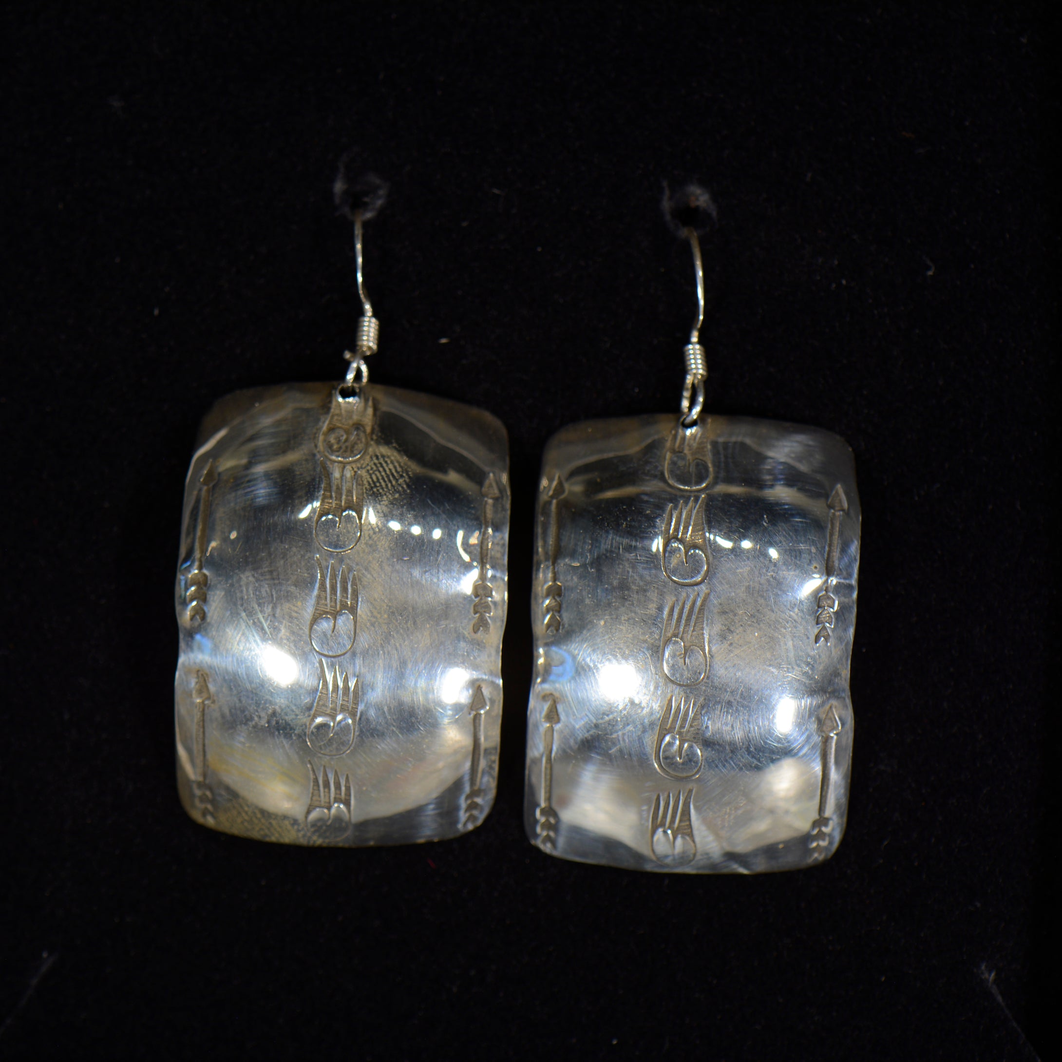 Silver earrings.