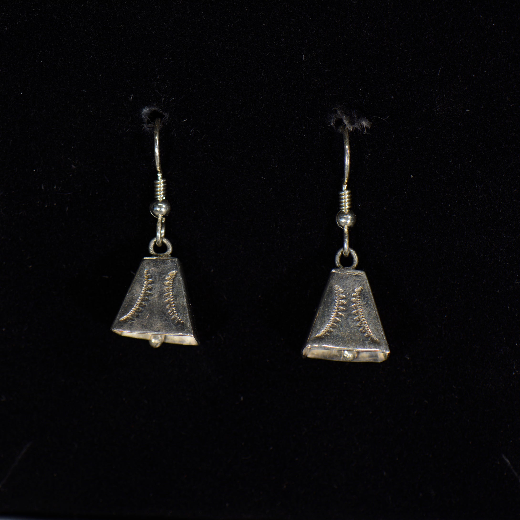 Silver earrings.