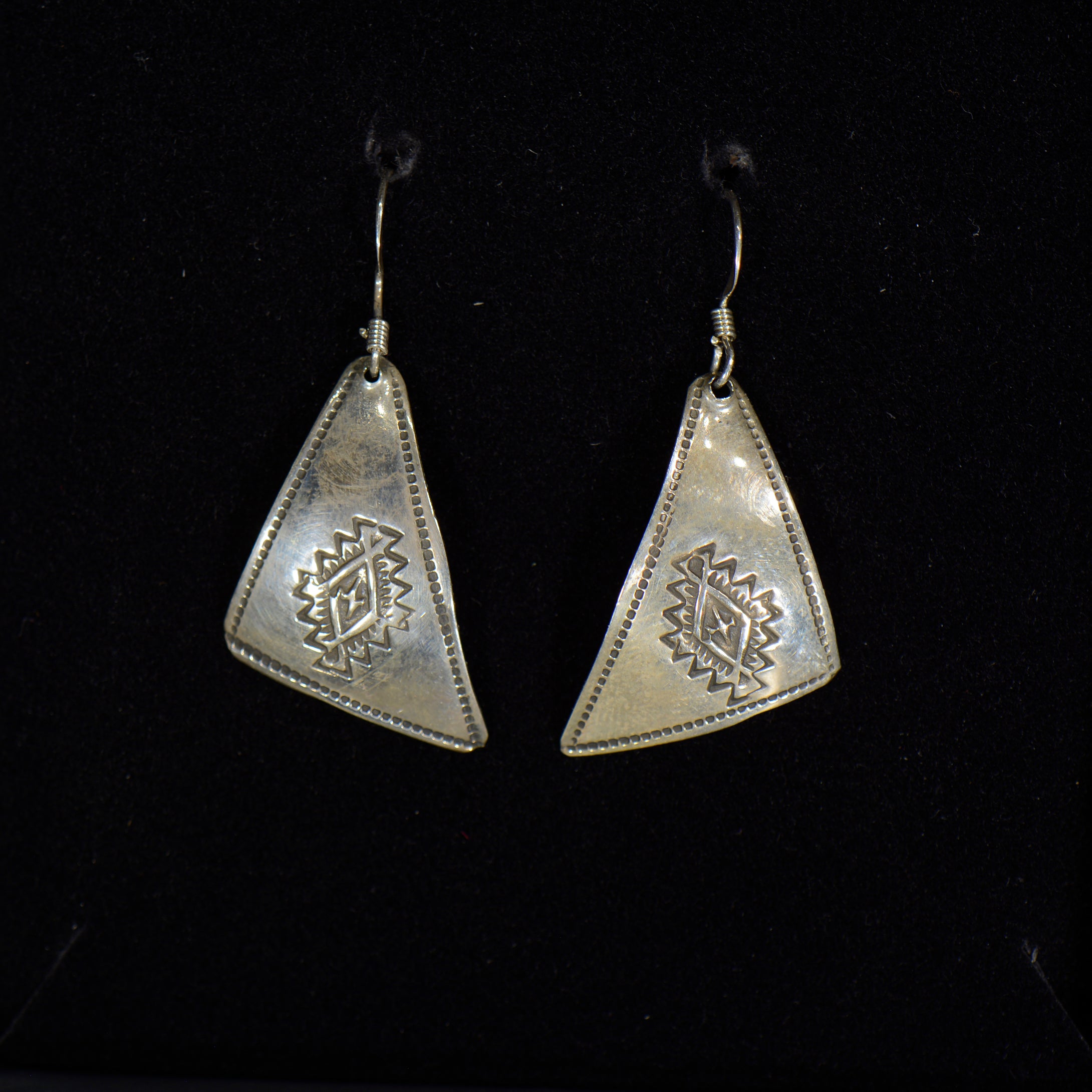 Silver earrings.