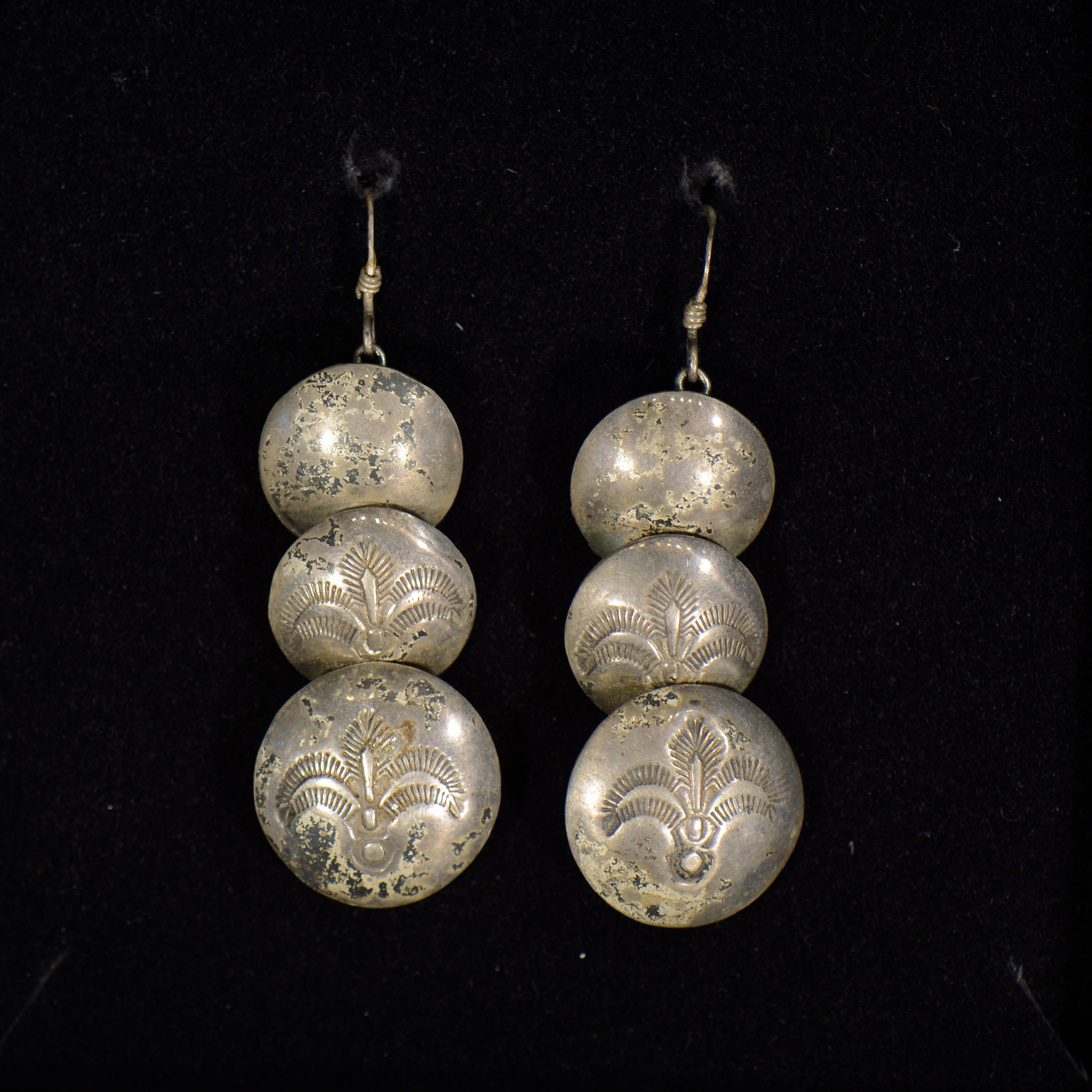 Silver earrings.