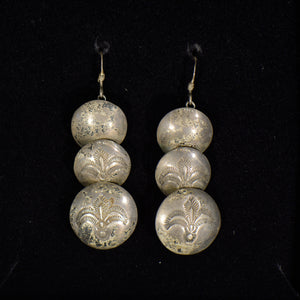 Silver earrings.