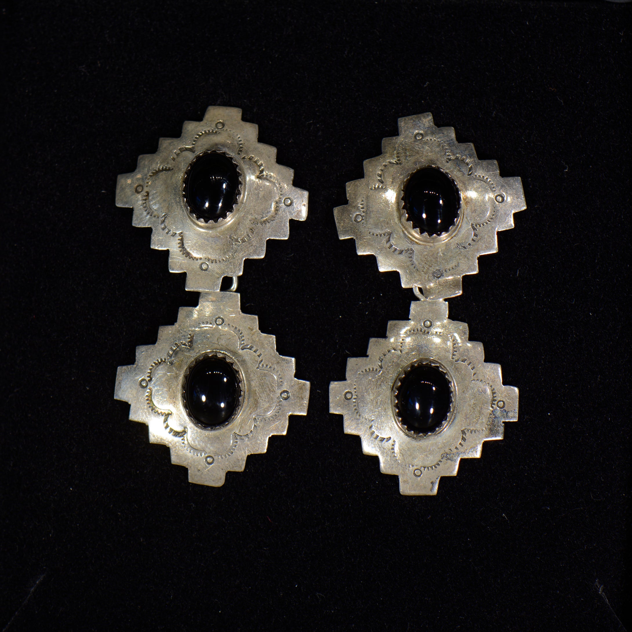 Silver and onyx earrings.