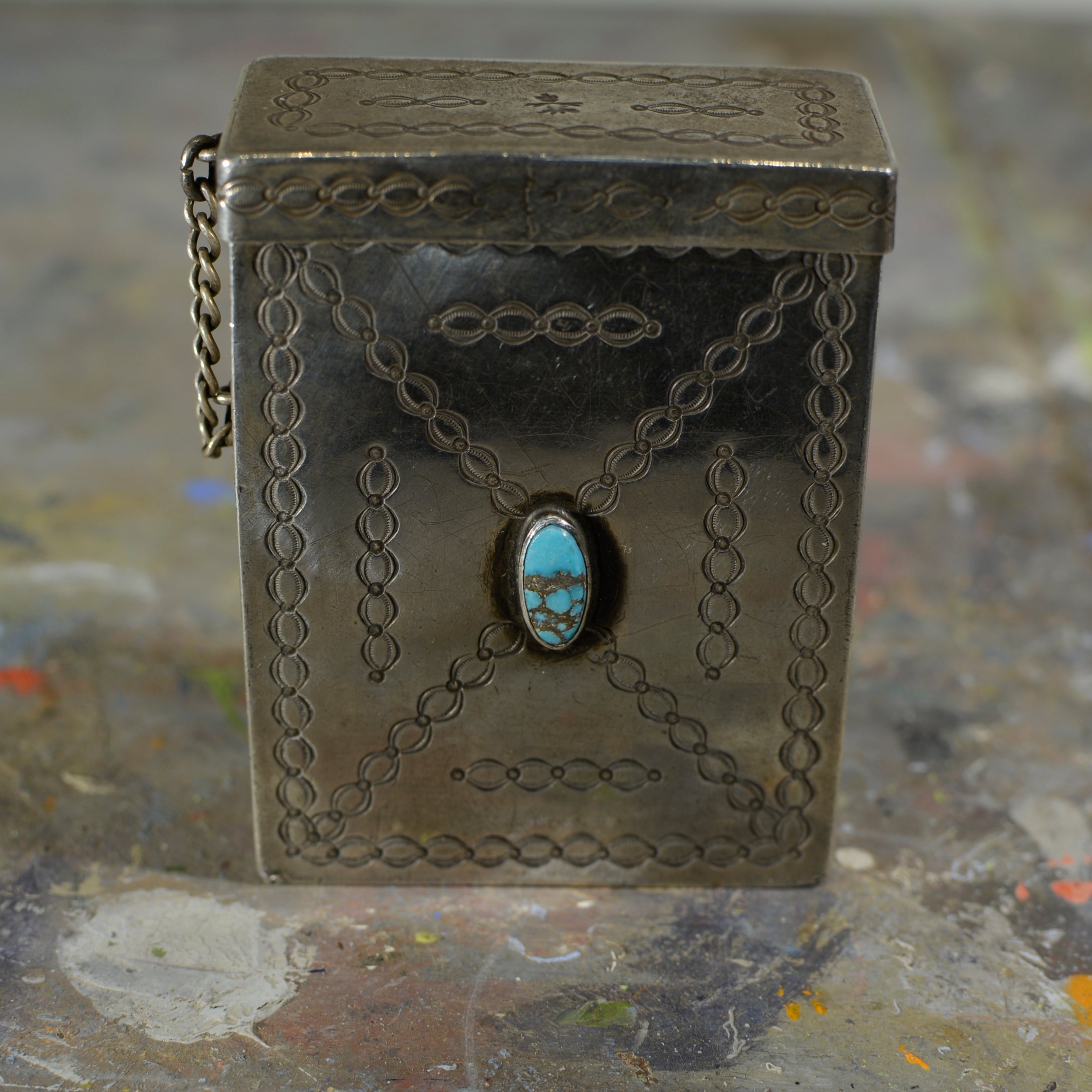Silver and turquoise cigarette case.