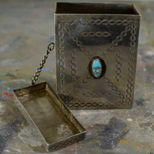 Silver and turquoise cigarette case.